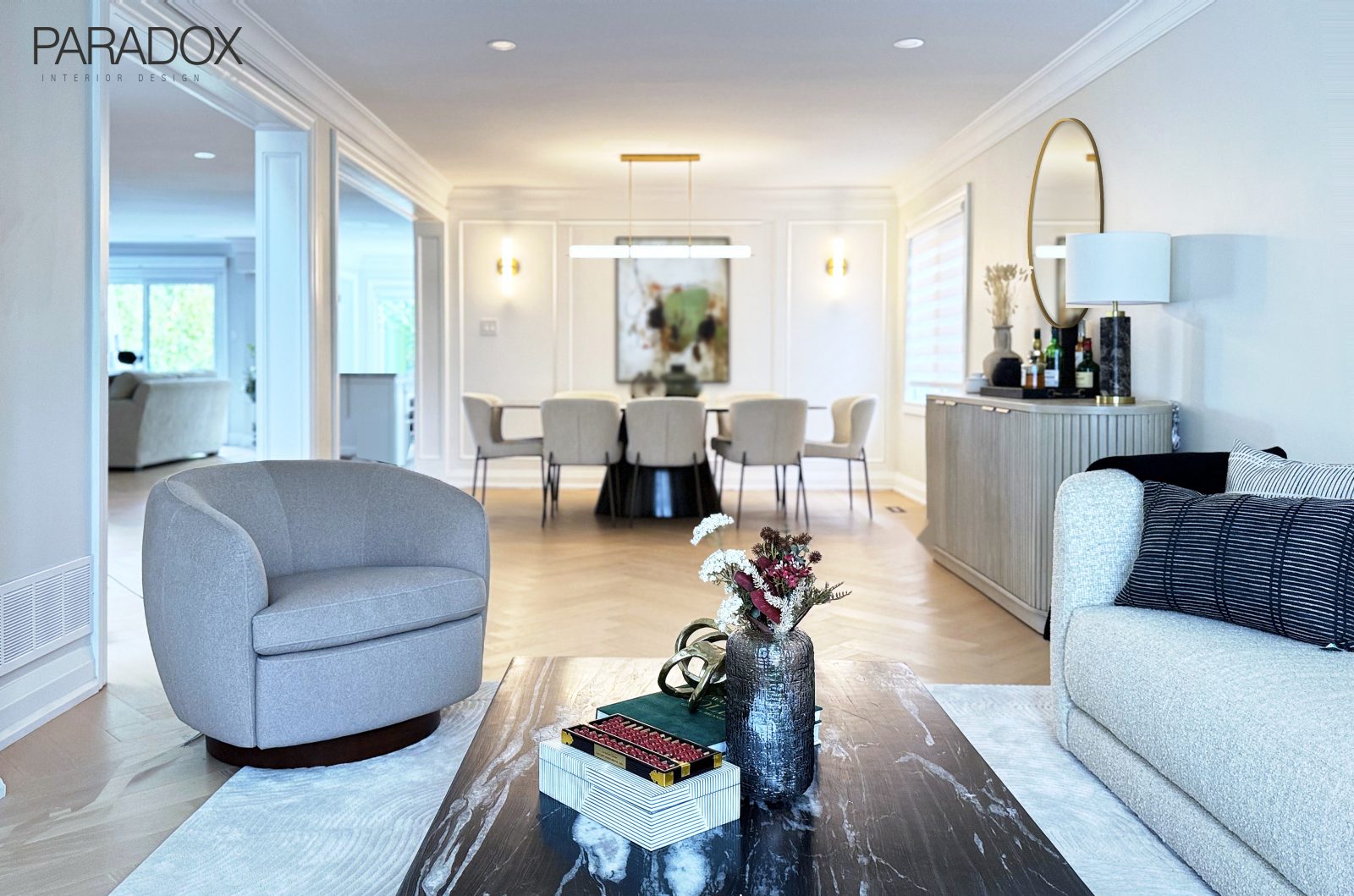 Richmond Hill living and dining room with herringbone hardwood floors, a marble dining table, a black marble coffee table and wall paneling