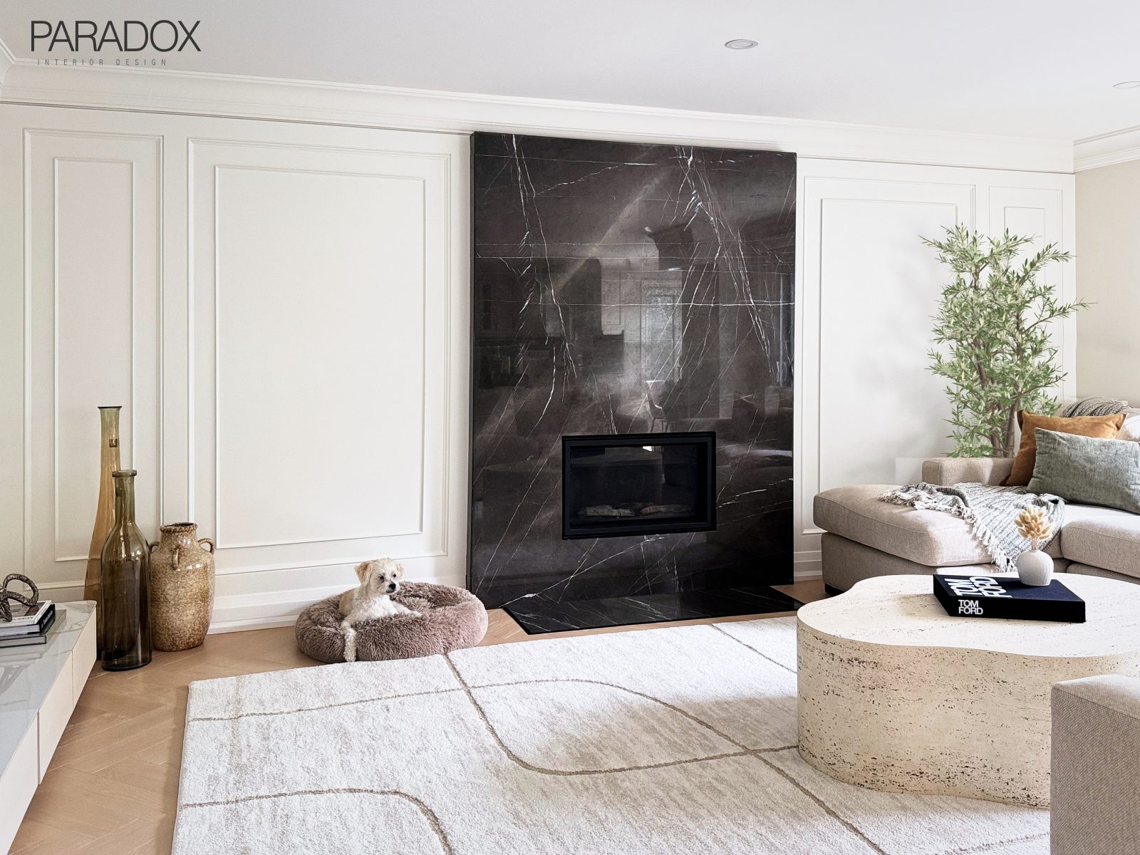 Richmond Hill living and dining room with herringbone hardwood floors, a marble dining table, a black marble coffee table and wall paneling, view 5